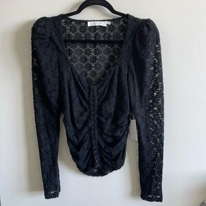 ASTR the label Leia top, size large, color black. Never worn tags on